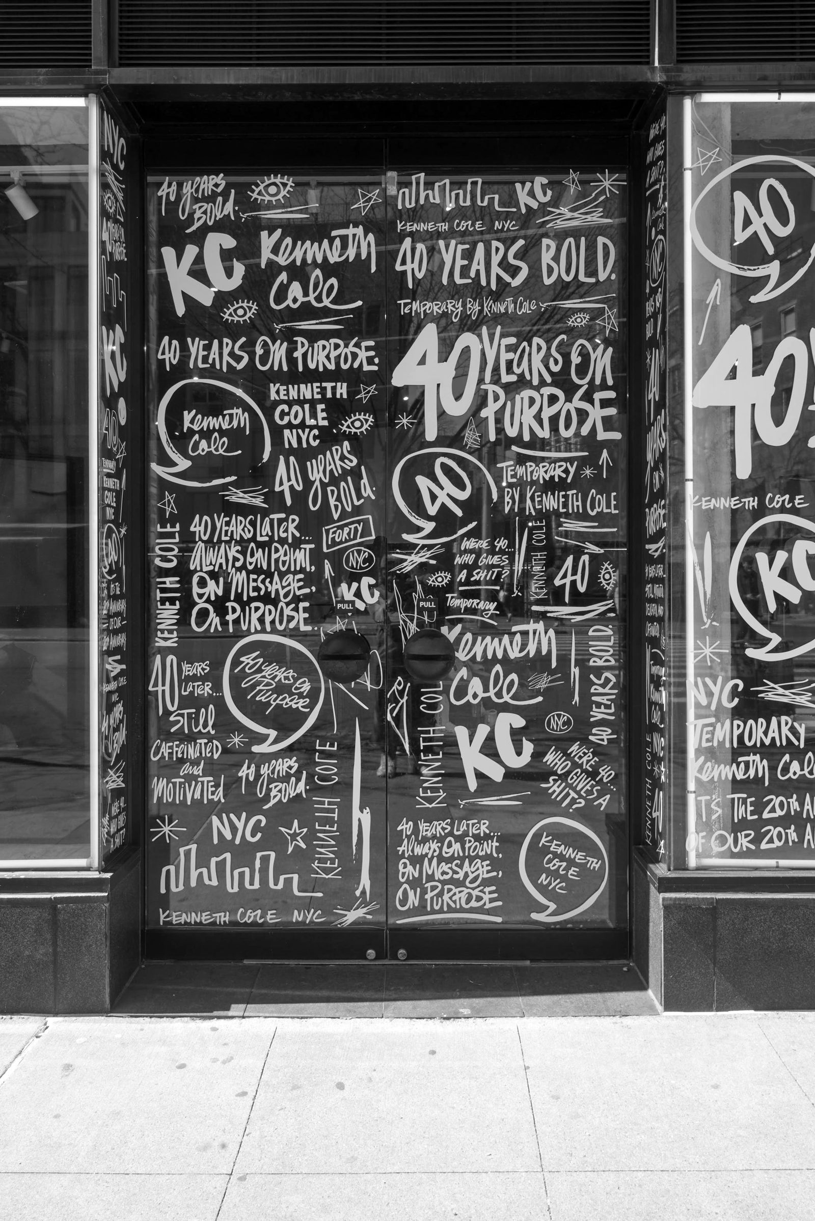 Kenneth Cole window covered in hand-drawn lettering
