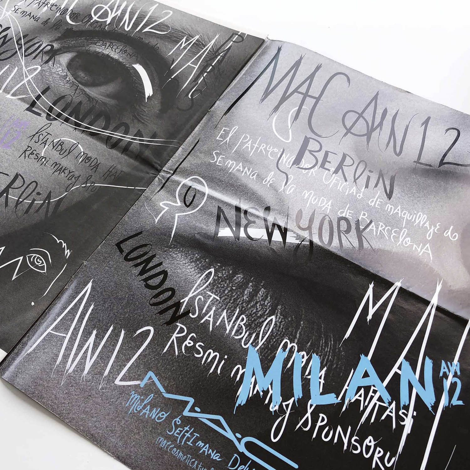 M·A·C AW12 trend book: an eye in black and white under hand-lettered Milan, Berlin and London
