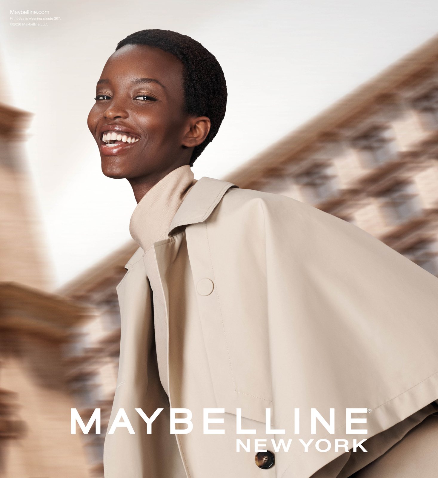 SuperStay Lumi-Matte key visual: model in a beige trench with the Maybelline wordmark