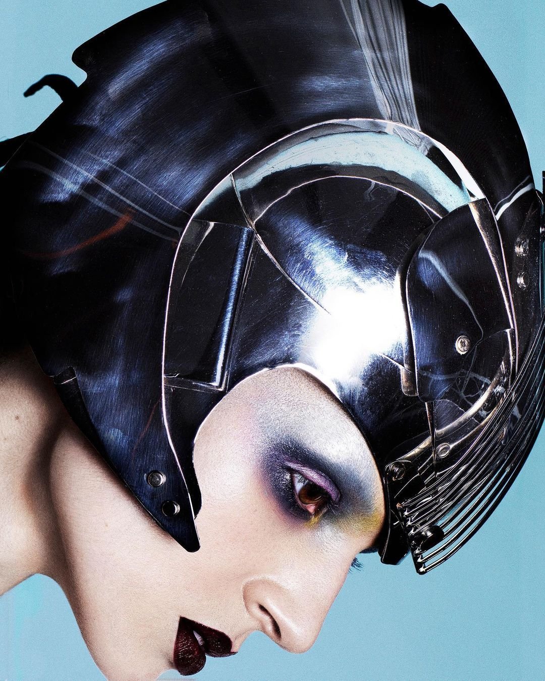 Poppy Beauty campaign portrait in a chrome helmet